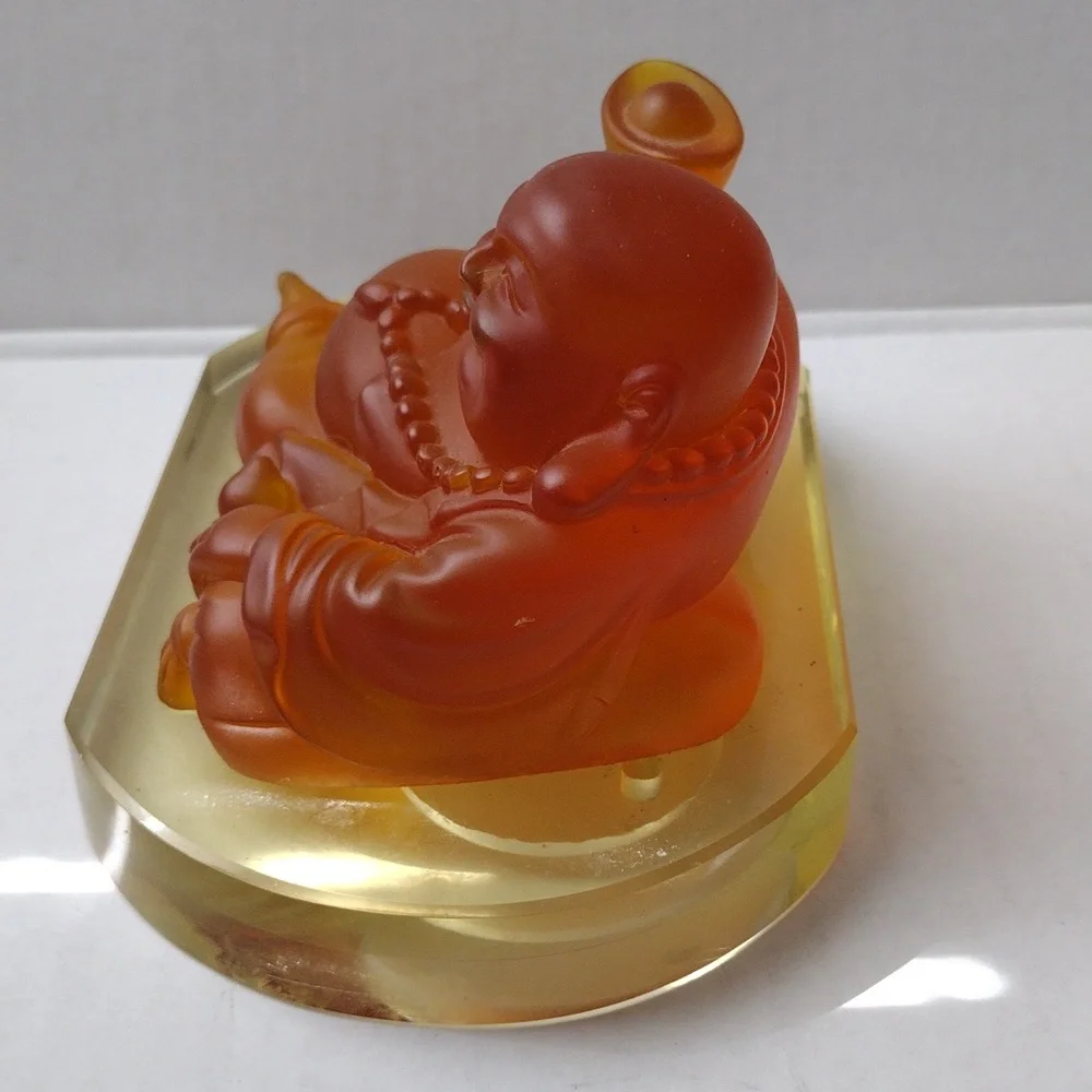 Orange Buddha Figurine